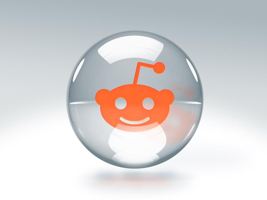 Bolha de vidro transparente com o logotipo do Reddit dentro dela, isolada em fundo transparente
